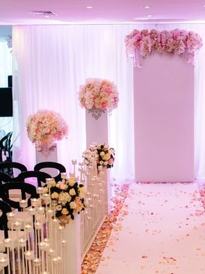 white and pink flowers arranged in a ceremony