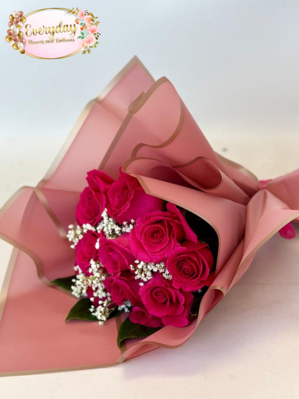 A Dozen Elegant Hot Pink Roses Wrapped for Mother's Day