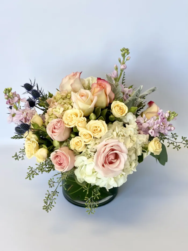 A bouquet of flowers in a glass vase